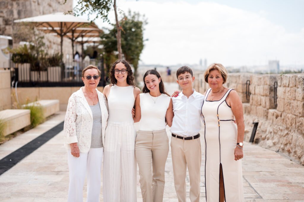 Bar Mitzvah celebration at the Western Wall in Jerusalem, captured by Pais Photos, professional photography preserving special family moments.