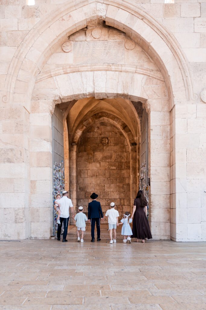 Family walking toward Jaffa Gate in Jerusalem’s Old City.