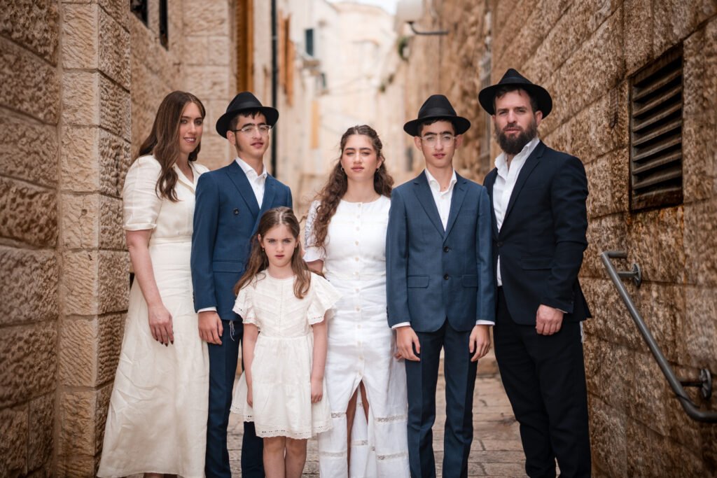 Family portrait in a narrow stone alley in Jerusalem’s Old City