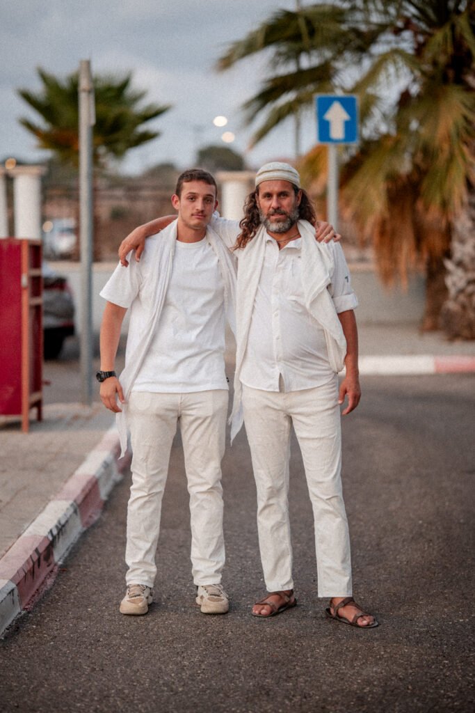 Pais Photos photography team, Oshry and Yahal, posing in Jerusalem, specializing in Bar Mitzvah and family photography.