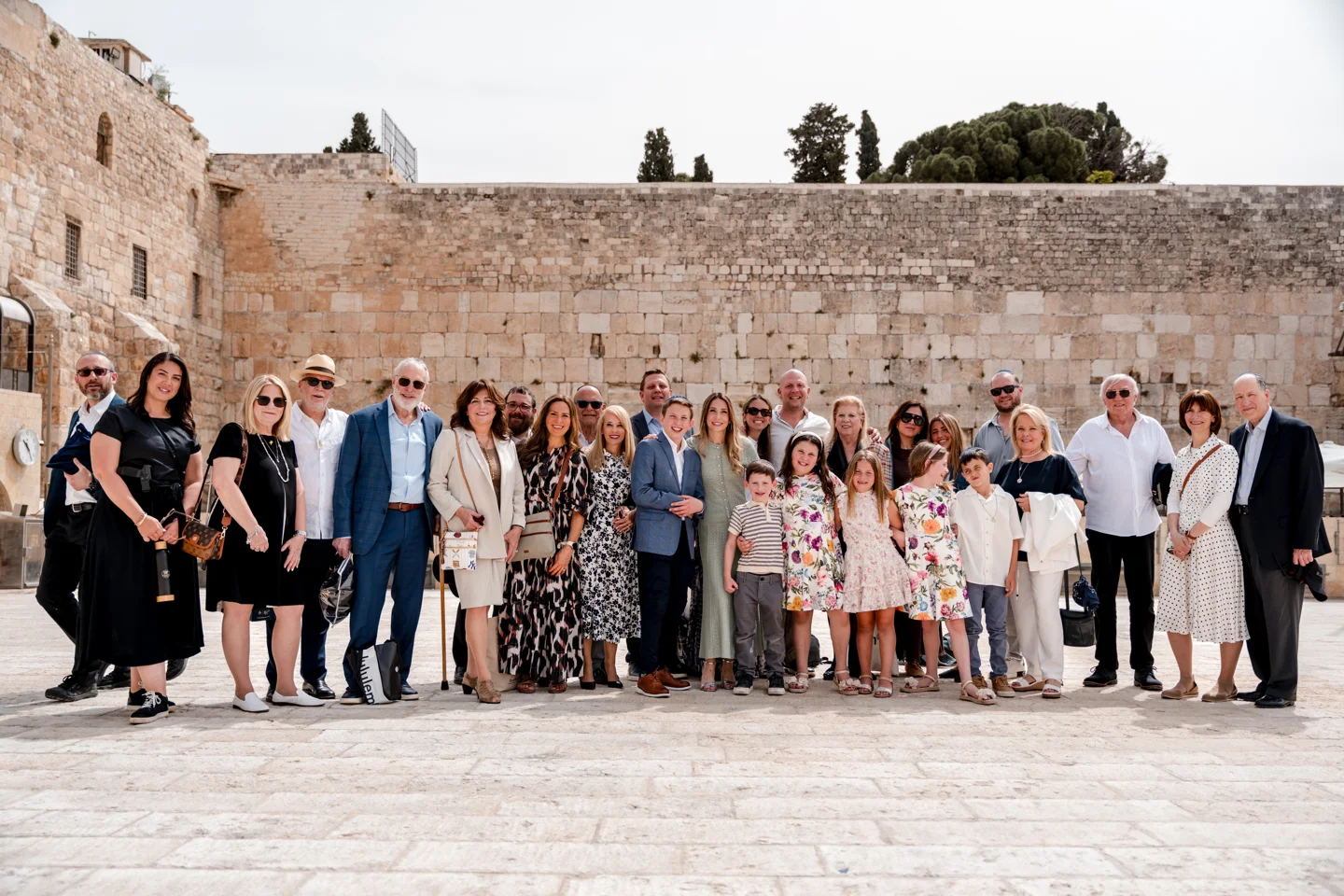 An extended family together for portraits in the Western Wall plaza